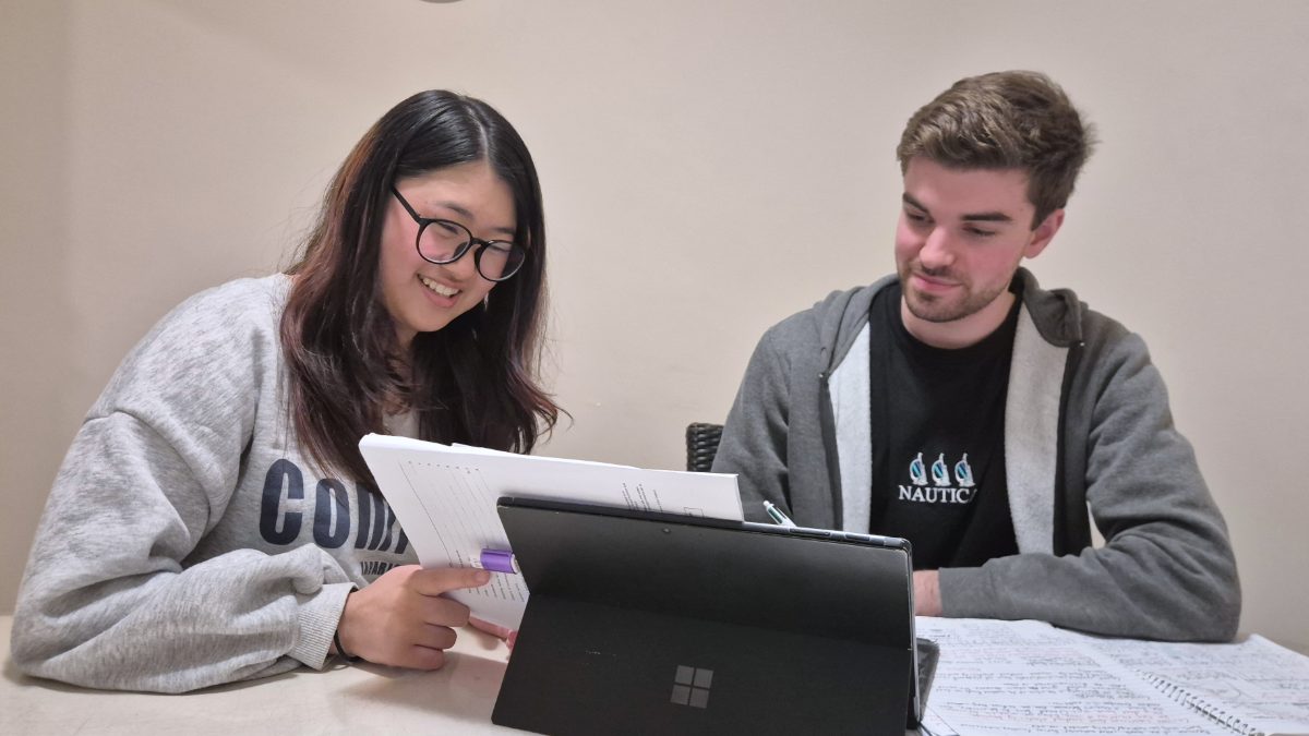 Two students working through their notes together at Young Einsteins